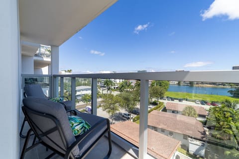 Private balcony with outdoor seating at Bay Harbor Islands vacation rental near Miami Beach and Bal Harbor Shops, perfect for relaxing with family or friends