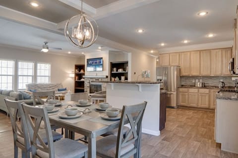 Room for 6 at the table and 4 more at at bar. The open concept makes this space great for families.