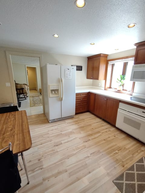 Kitchen fully stocked with dishes and cooking utensils