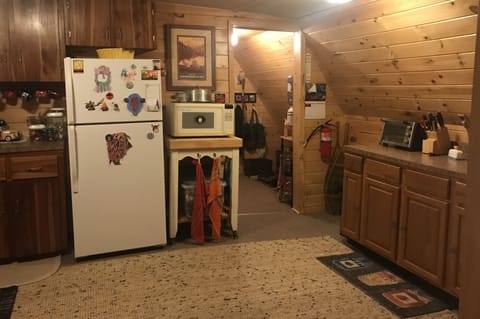 View from kitchen into back hall, bathroom and sun porch area