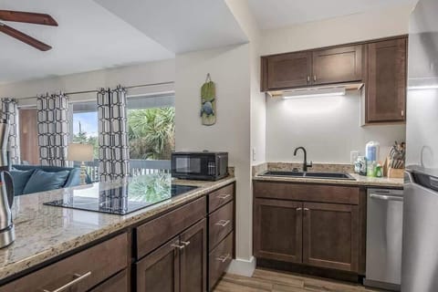 We've stocked this kitchen with a refrigerator, dishwasher, electric stovetop, and a large toaster oven.