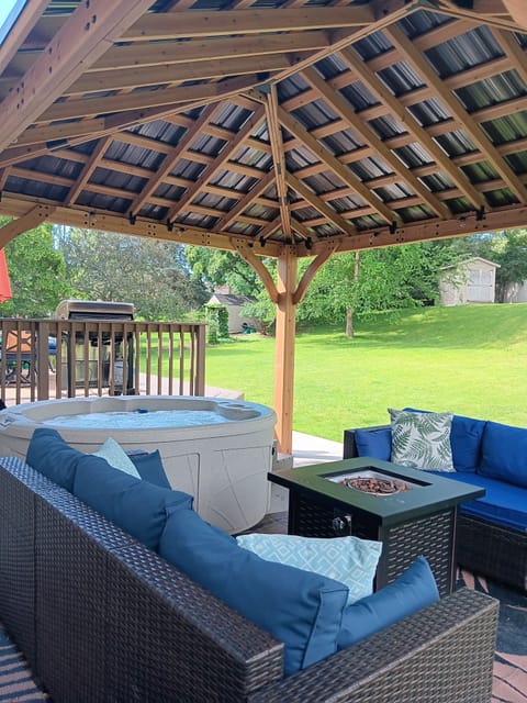 Gazebo 16' x 20' with 2 outdoor couches and fire table