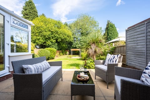 Relax outside on the patio with our Rattan furniture and soak up the garden view
