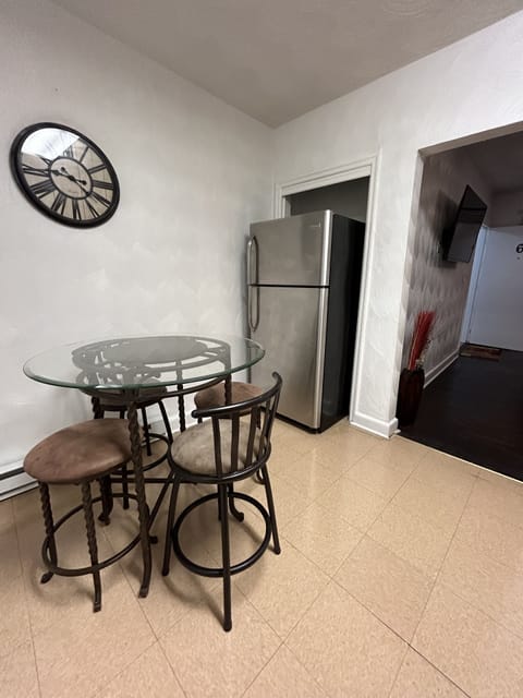 Full size refrigerator with seating area inside kitchen