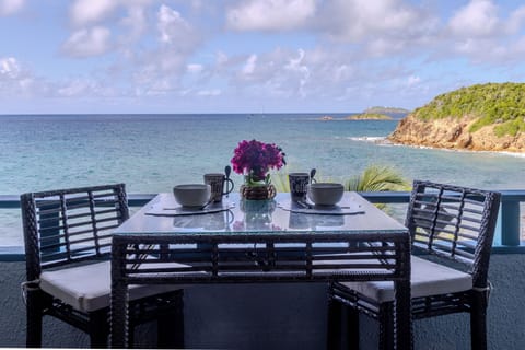 Oceanfront balcony with seating to relax and enjoy the view