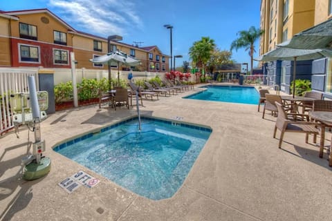 Unwind in the bubbling hot tub beside the pool deck.