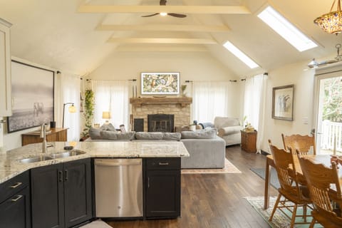 Main living area of home with open concept kitchen/dining/living room. 