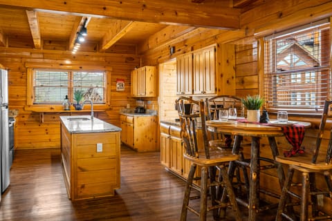 There is also a high top table that can seat 3 right by the kitchen.