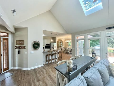 Extra seating that the kitchen countertop and table behind the sectional