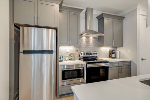 Kitchen with plenty of pots, pans, and utensils