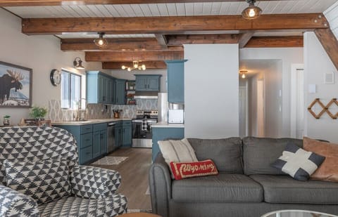 Cozy open concept cabin with comfortable seating in the living room.