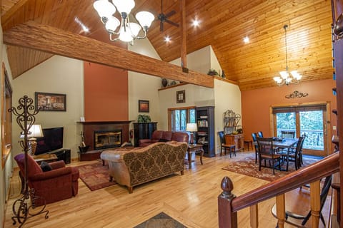 Grand living room with wood-burning fireplace
