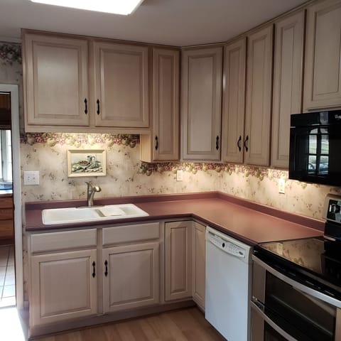 Full size kitchen with fridge, dishwasher, microwave, stove and double oven.