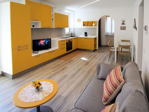 Furniture, Property, Cabinetry, Table, Countertop, Wood, Orange, Couch, Yellow, Lighting