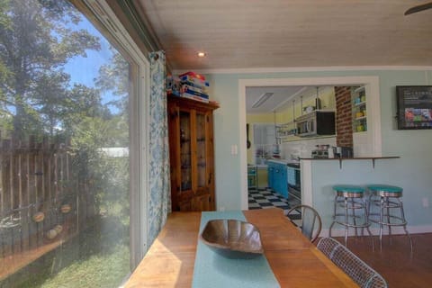 The picture window by the dining table lets in a lot of light.