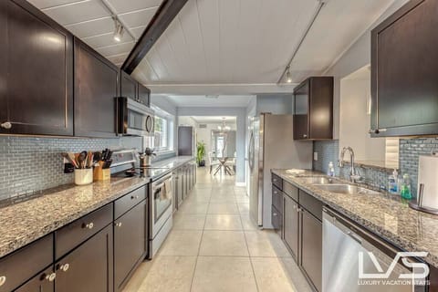 MAIN HOUSE KITCHEN #1- Fully Appointed Updated Kitchen with Stainless Steal Appliances (Microwave, Refrigerator, Ceramic Cooktop & Oven, Dishwasher, Toaster, Regular Drip Coffee Maker & Fully Stocked with Pots/Pans, Baking Pans, Dishware, Silverware & Glassware.