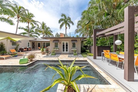 Welcome to Modern Mid Century Oasis, your private retreat <5 min from the beach