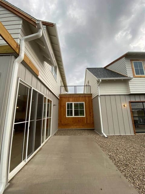 view of the main house and garage apartment connection (sun deck)