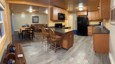 Open floor plan with fully equipped kitchen.