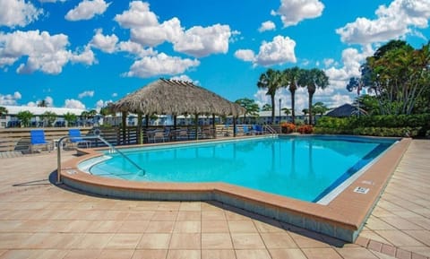 Pool, cabanas and clubhouse with kitchen, bathrooms and grills