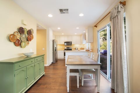 Gather for a meal or a board game in the sunlit dining area--table seats six.