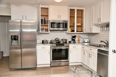 Kitchen has high end cookware, gadgets an utensils for cooking.  Induction Stove