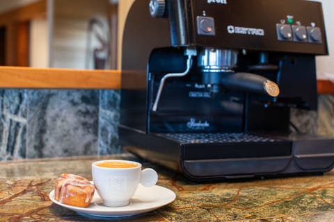 We provide the espresso machine but you'll have to bring your own barista!
