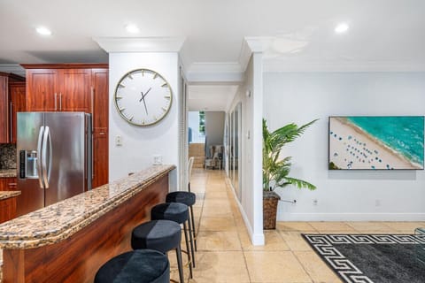 Enter a space where the kitchen blends seamlessly with the living room.