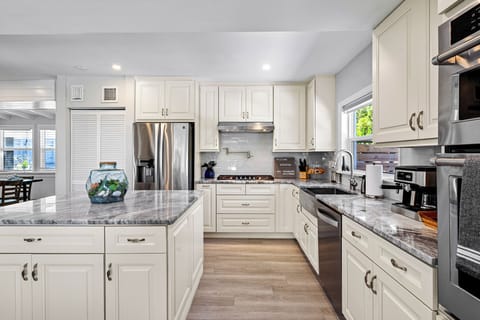 Oven / microwave stack separate from gas range and pot filler