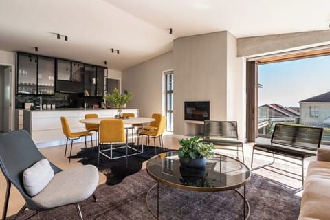 Upstairs lounge area with dining and fireplace