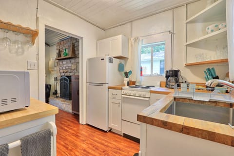 Full kitchen with stove, oven, refrigerator, microwave, and coffee maker