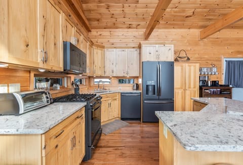 Quartz counters with breakfast bar (Main House)