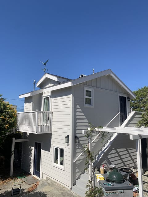 exterior view of the cottage above the garage, which is accessed by the stairs