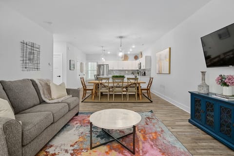 Open floor concept connecting living room, dining room and kitchen to entertain