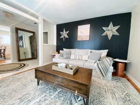 Sit back and relax in our comfortable living space with a plush couch and TV!