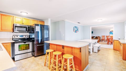 Once you're finished cooking dinner, enjoy your meal seated at our kitchen island (3).