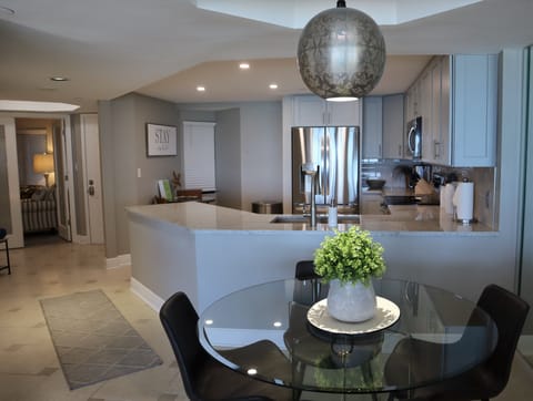 Dining table right off of the spacious kitchen, plus a breakfast - Dining table right off of the spacious kitchen, plus a breakfast nook on the other side of the kitchen.