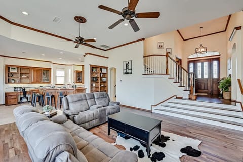 Main living room with kitchen and entryway