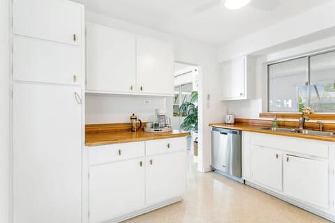 Original wood cabinets by the original owners have been refreshed