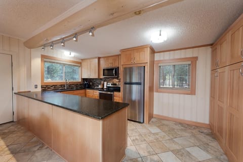 Kitchen fully stocked with cookware and bakeware.