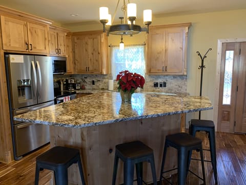 Kitchen ready for a feast. Fully stocked with dishes and cooking gear.