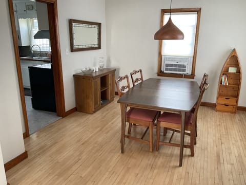 Dining room with top-up-bottom-down cellular shades.