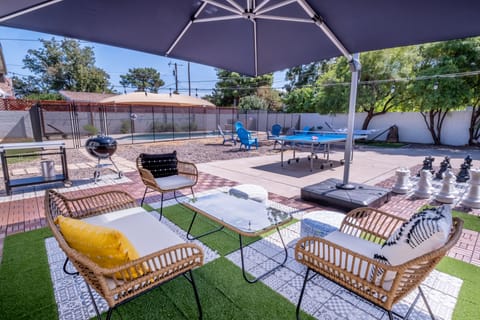 Relax in the backyard. Umbrella replaced by shade sail 
