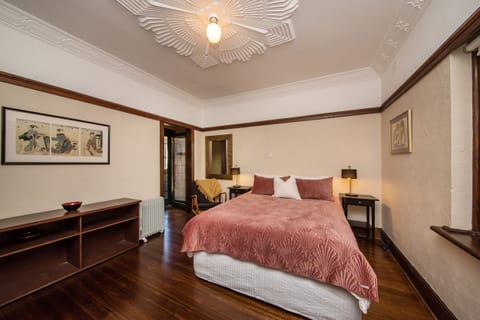 The spacious bedroom has access to the gated terrace.