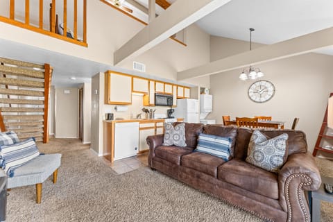 Open-concept living, dining, and lofted ceilings create a roomy, relaxed feel.