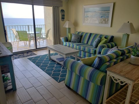 Bright and beachy open living area - couch is queen pullout