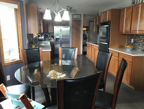 Dining table seats 6.  Extra chairs and folding table available in the garage.