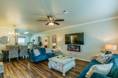 Living Room with 70 inch TV and Fireplace