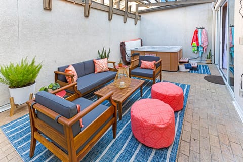 Private patio with a hot tub