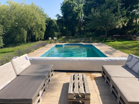Glebe Hall swimming pool and sun lounging sofas.